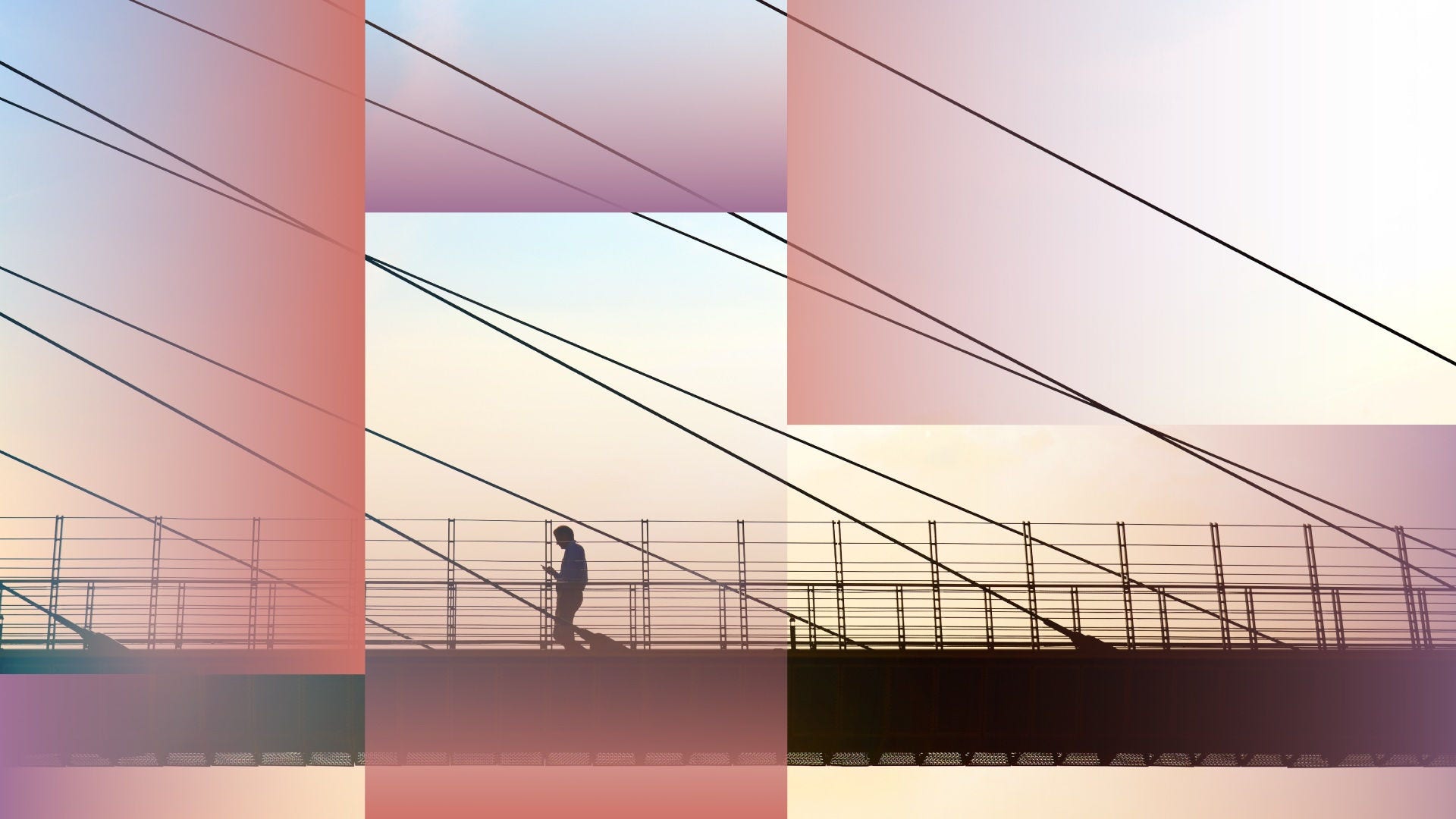Man crossing a bridge while looking at his smartphone