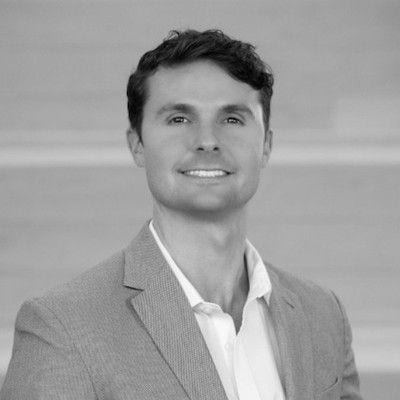 Shane Wiggin's headshot, greyscale