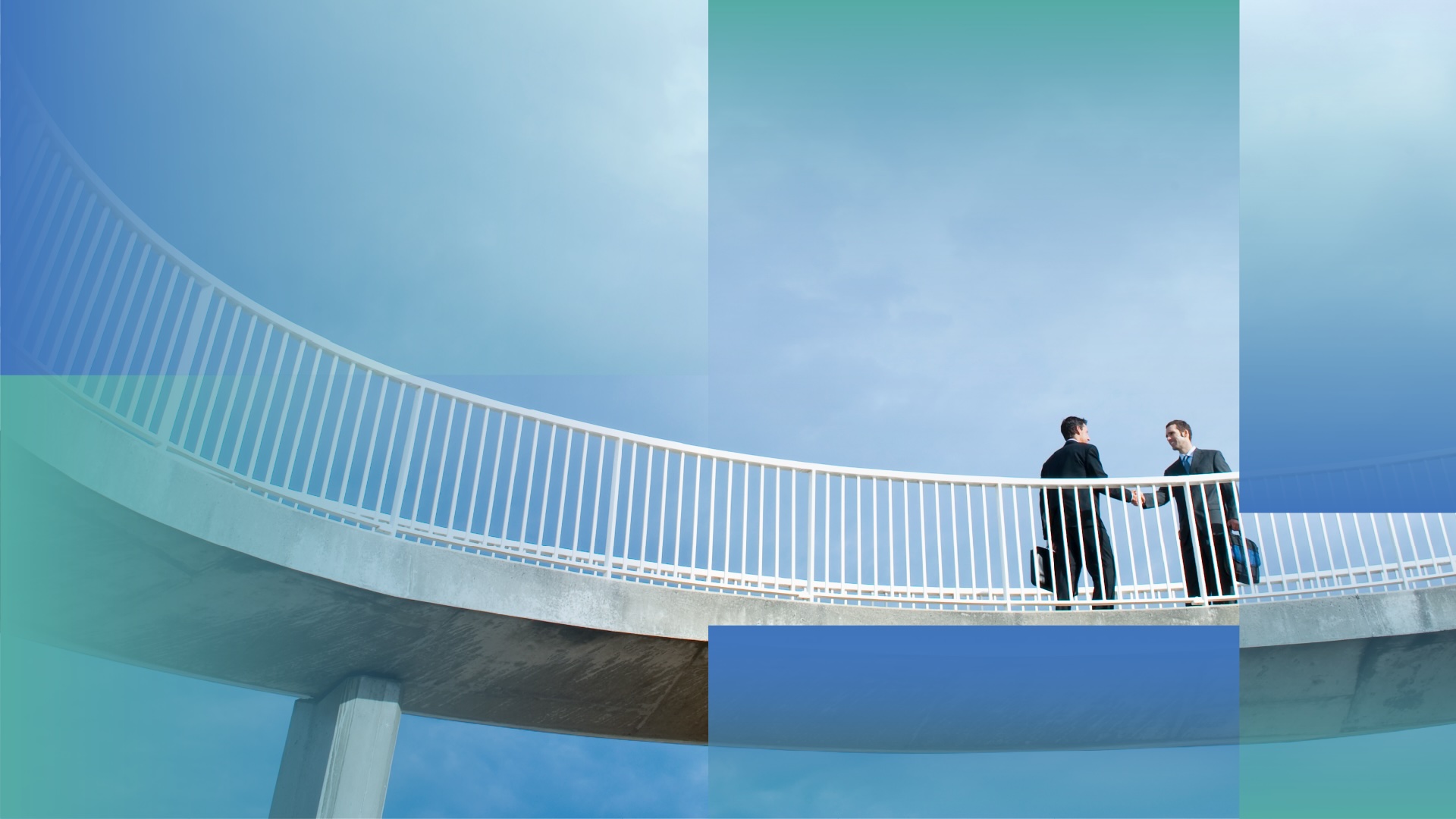 Two men shaking hands on a skybridge