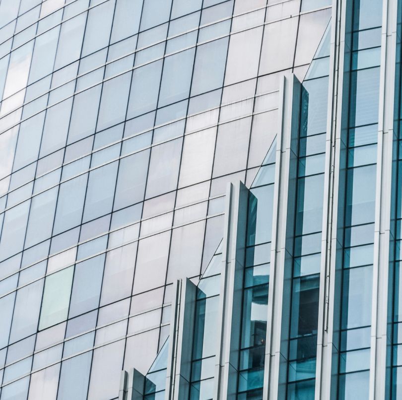 Close up photo of a glass windowed office façade